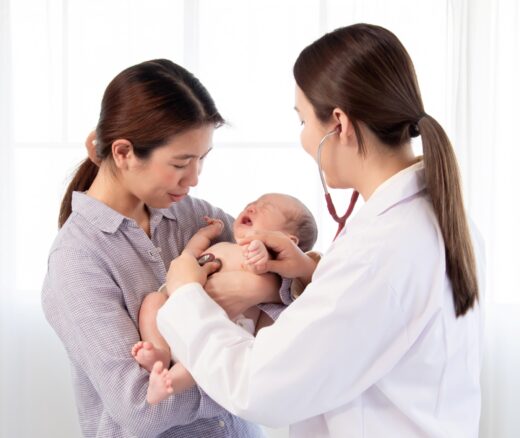 Mother and newborn being seen by doctor