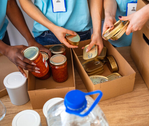 Small mixed race group of people working in charitable foundation.