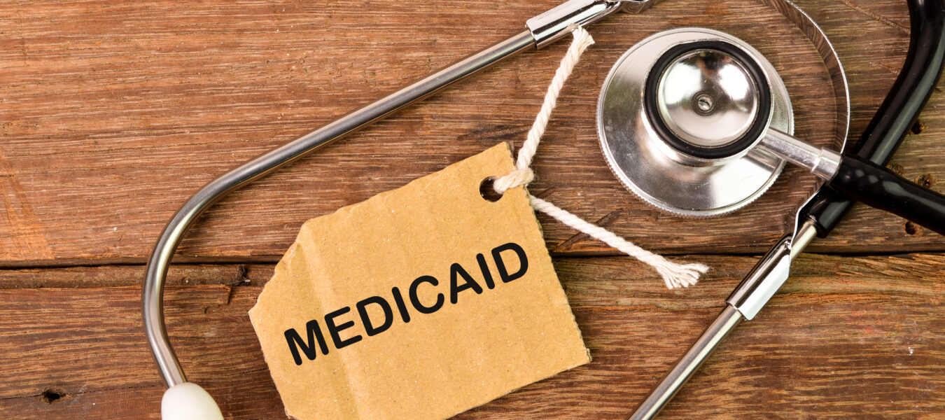 Top view of stethoscope and label tag written with text MEDICAID.