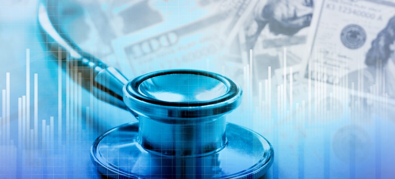 A stethoscope with U.S. dollars in the background.