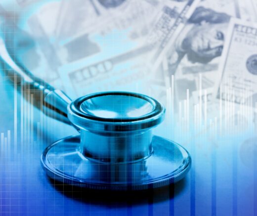 A stethoscope with U.S. dollars in the background.