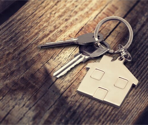 Keys and a house charm on a kewchain.