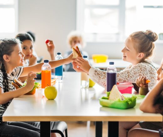 Children sitting at a lunch table.