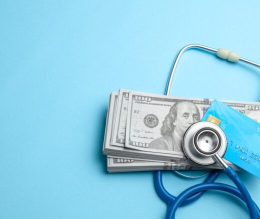 A stethoscope with money on top of it