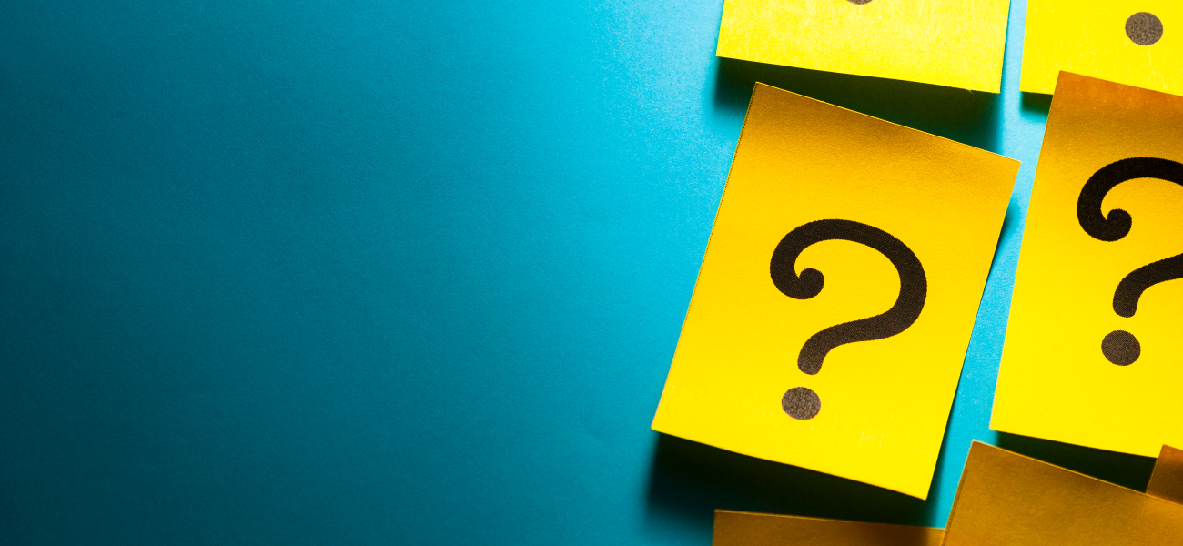 Yellow Post-It notes with question marks on them