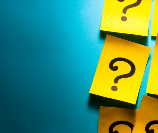 Yellow Post-It notes with question marks on them