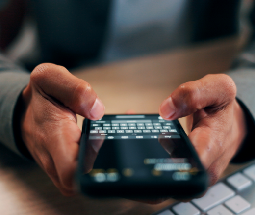 A person typing a text message on a smartphone.