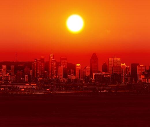 Image of the sun above a city skyline