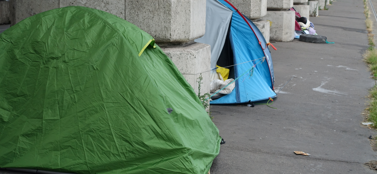 A row of tents on a city street.