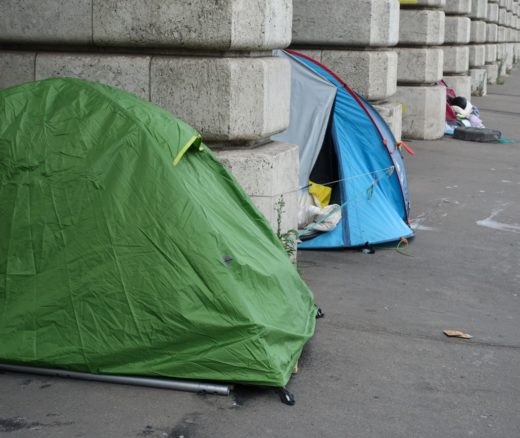 A row of tents on a city street.
