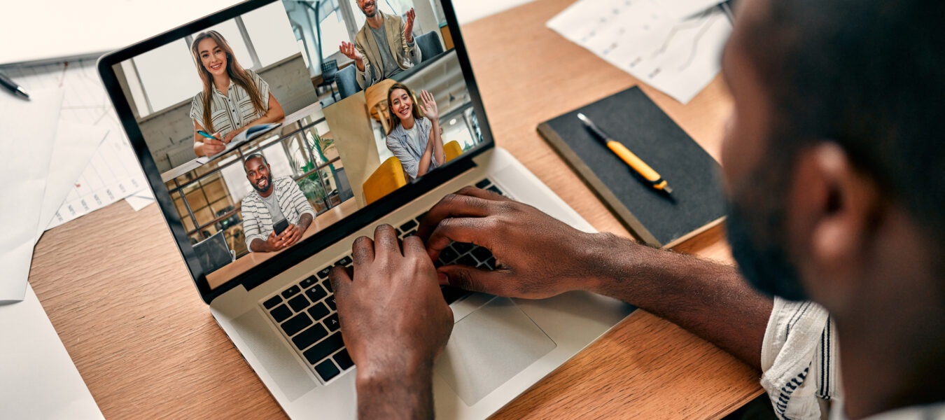 A person attending a Zoom meeting on their laptop.