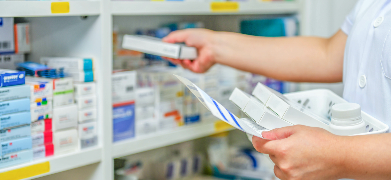 A pharmacist filling prescriptions.