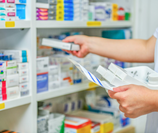 A pharmacist filling prescriptions.