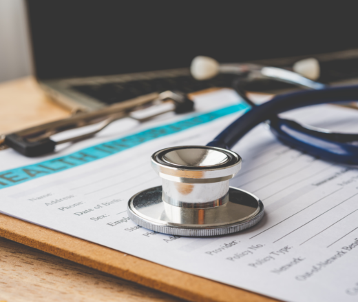 A stethoscope on top of a clipboard