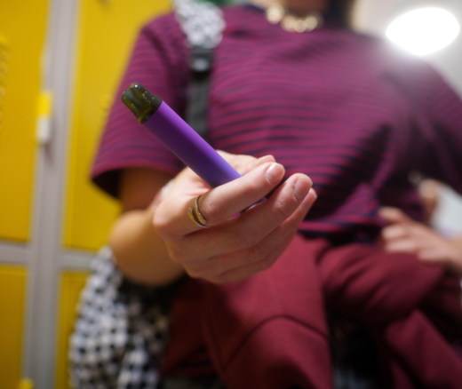 A person holding a vape