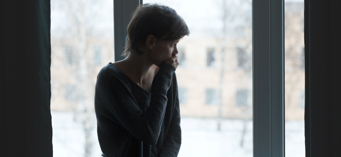 A woman looking out a window