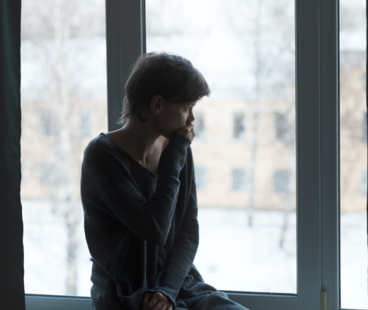 A woman looking out a window