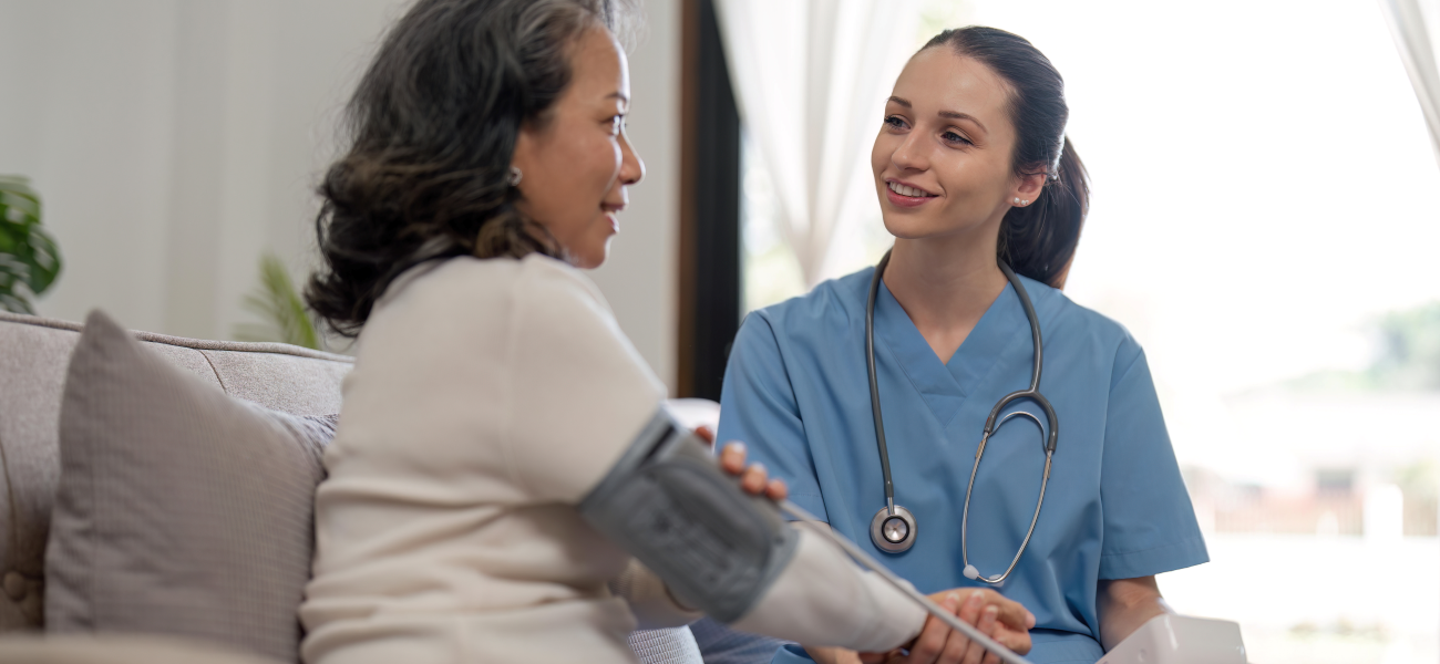 A nurse speaking to a patient