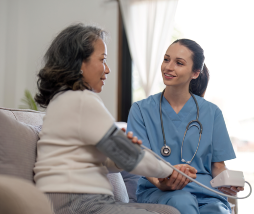 A nurse speaking to a patient